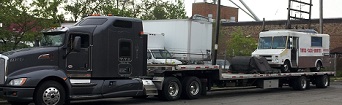 bread truck on trailer truck transport photo