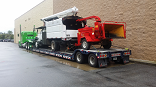 bucket truck and chipper x truck transport photo