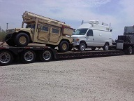 humv and van on rgn trailer 1 truck transport photo